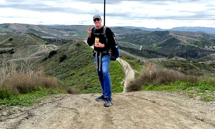 GREG WALKING WITH STATION